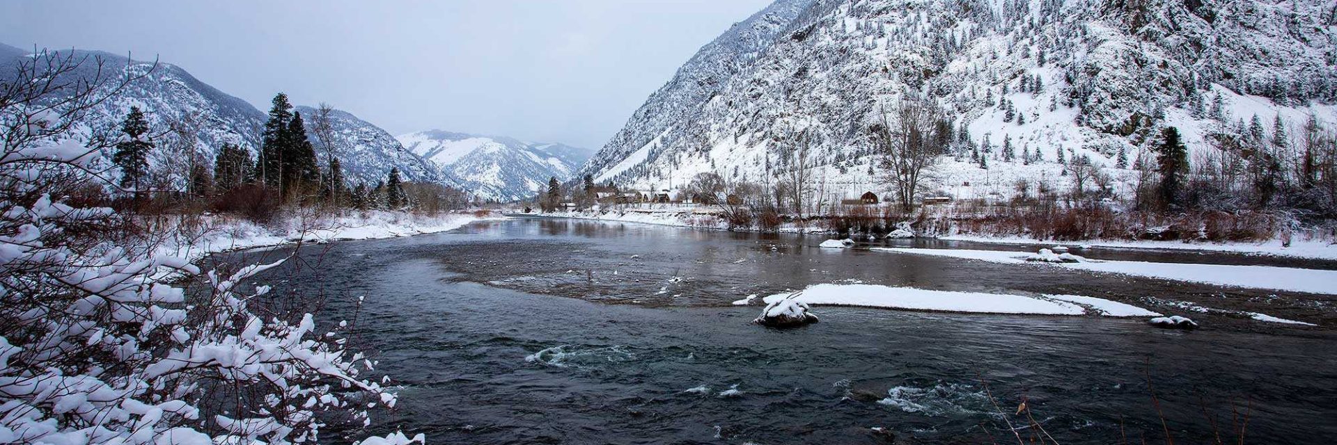 Similkameen River with snow covered mountains in early winter.