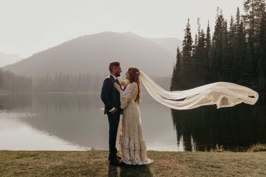 Manning Park Resort Couple just married in front of lake at Manning park.